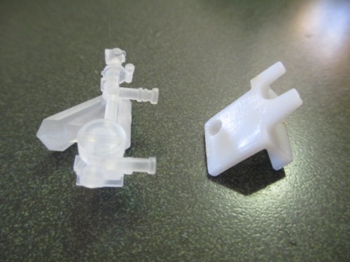 Gunsight plus plastic widget modified to fit the gunsight base.