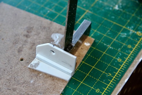 Pivot bracket echoes shape of turret