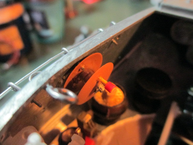 In the interest of having time to do it, I rebuilt the phone wire reel into something closer to approximating another angle of view photograph I found of it.