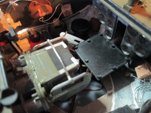 A cut down of the  bolts using a Dremel followed by a diamond filing and replacement of the nuts and mounting the 3D printed cover produced a better looking &amp; operating servo