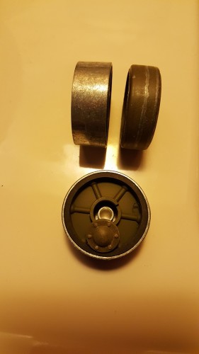 Width difference between the HL and MATO idler wheel is easily seen alongside one of the modified MATO idler wheels