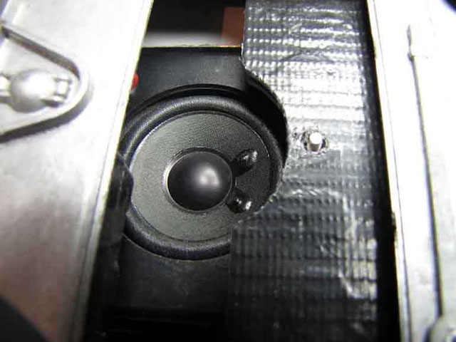 The reason for the cutaway now becomes more obvious - the added benefit here is raising the speaker much closer to the engine deck doors