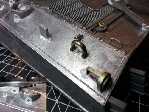 Just above the lifting eye is the rearmost tow cable clasp.