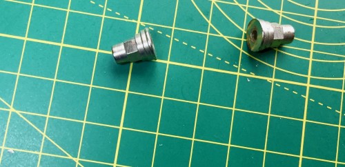 Track adjuster housing caps