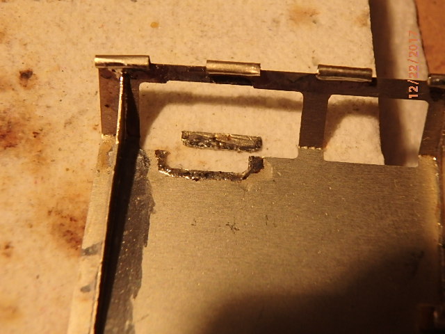 Cut a piece of brass sprue and shaped to fit in notched area.
