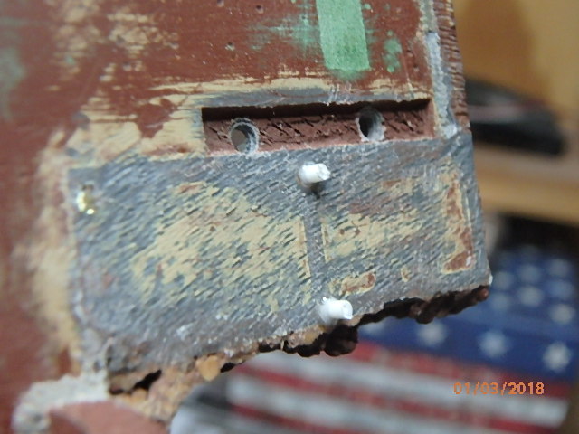 Using some plastic rod to fill holes...glued in place.