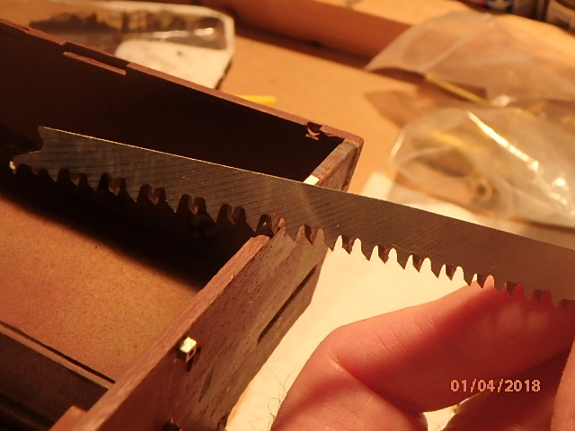 Tilt at about 45 degrees and pull back towards you. Don't try to push, it may chip plastic.