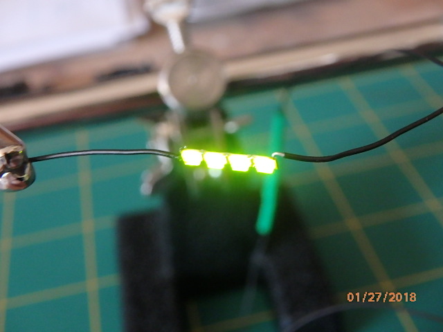 GOT THE WIRE LEEDS SOLDERED AND A 100 OHM RESISTOR...WE HAVE LIGHTS!!!