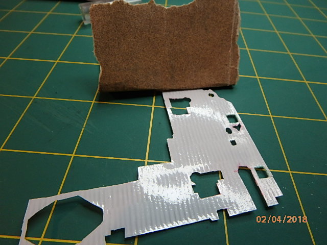 I forgot to sand back while it was still on the sheet, so I carefully and gently sanded to sheen off the back to give the glue something to bite into.