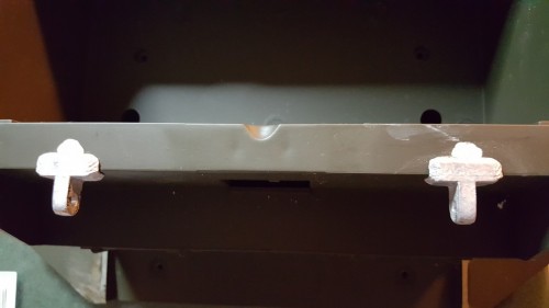 Permanently mounted L brackets and magnets on the cover will keep this space closed but usable.