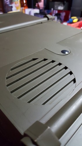 Stuart external speaker grill.  Tiny slit openings on only one side of the indented slots.