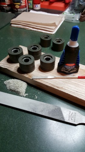Afterwards the spacers' center openings are Dremel tool sanded out to the right diameter to slip over the axle shaft.