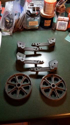 Two different types of plastic also make up the idler arms and wheels.