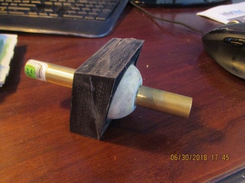 two hollow sphere halves glued together