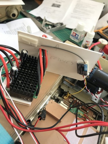 The heavier part holds the two ESC's away from the metal side