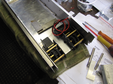 Trial fit of motors .  The strengthening bars in the bottom corners are visible as well as the side spacers,
