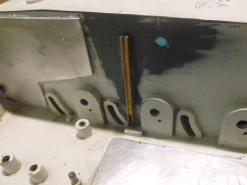 Brass channel bonded either side of hull to hold fire wall behind gearboxes.