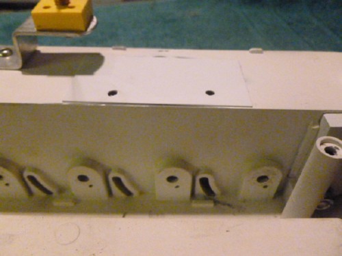 New holes for speaker further rearward and original holes covered and filled