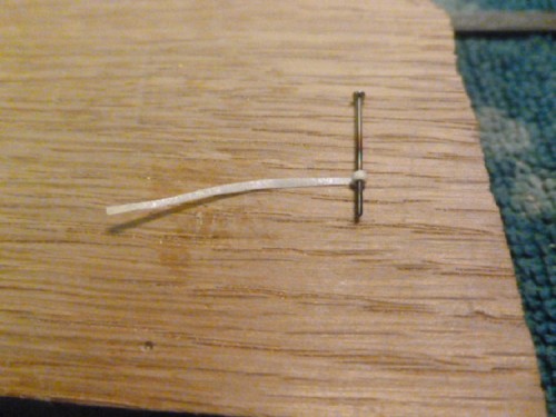 Sowing pin used as bar. Super thin masking tape used to made collar.