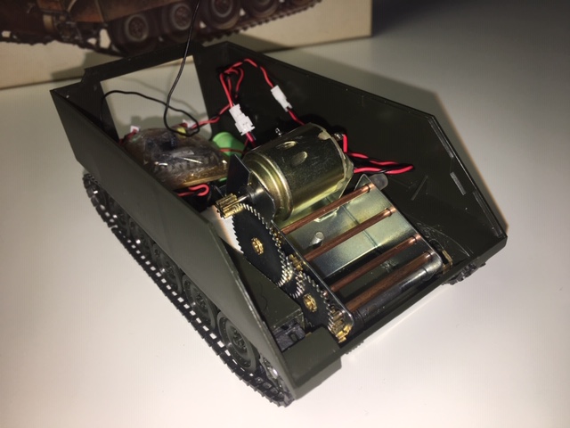 Single motor motorized converted to radio control forward\reverse\stop. It is the beginning phase of this build to see if the tracks\sprockets are up to par. I will not go any further if they are not.