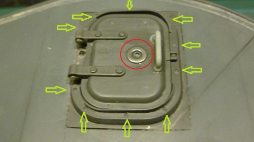 Drill around the frame to replicate the recessed bolts and external locking plate on lid formed by small steel washer.