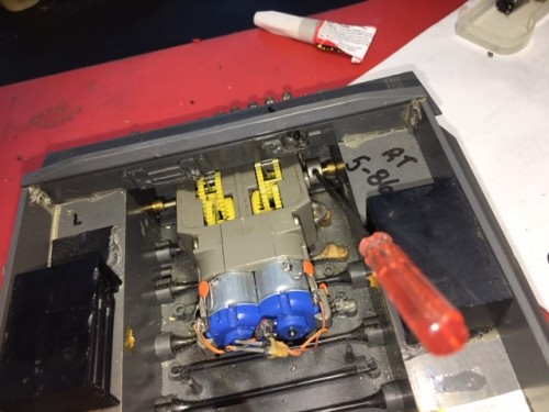Two allen head screws with collars hold this gearbox in, that's it!