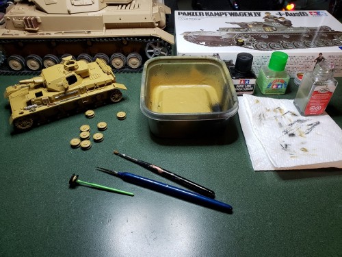 I came to my senses and removed the roadwheels on the other side before painting....jpg
