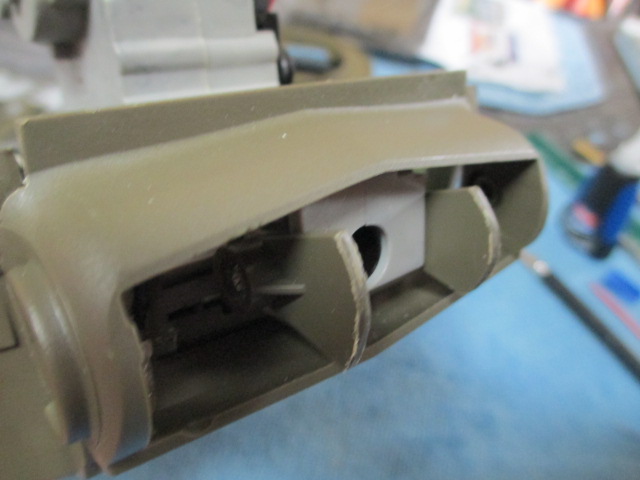 A scratch trunnion and mantlet mount made from a Tamiya cable mount.  Cut it in half and rounded the edges to fit the mantlet interior curvature..JPG