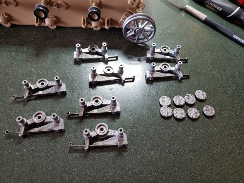 Taigen replacement set uses a long and short leaf spring and an angle spring in between the two pieces of the Bogie.  Much better detailed..jpg