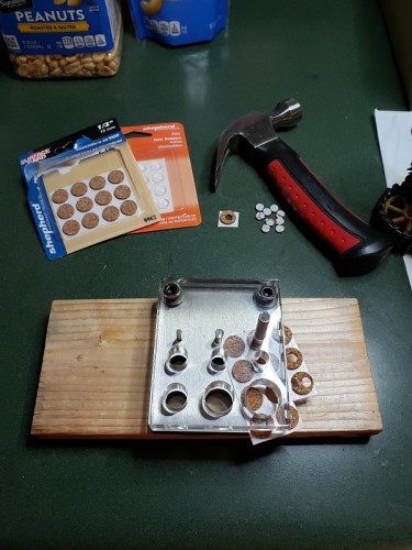 I looked at rubber stops as well and went with the cork due to it's flatter profile...stops made out of rubber sheet can be used if required..jpg