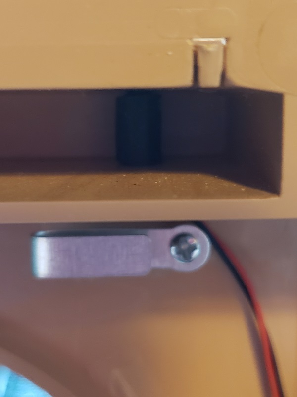 Remounted wire guide tower and the press fit rubber tube that holds the broken swivel shaft in place.....jpg