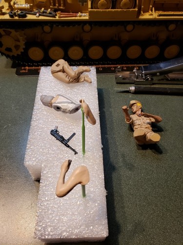 Initial coats of fabric tan on the trousers follow drilling and paint work on the MP40.jpg