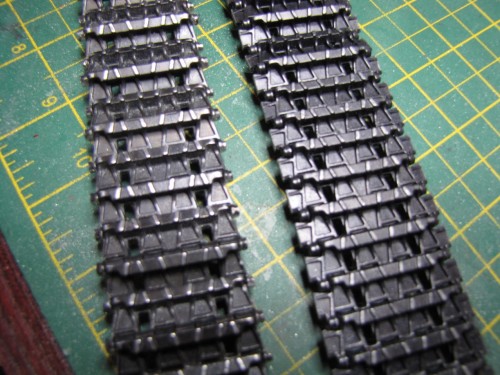 Painted track after grinding off oustside compared to original